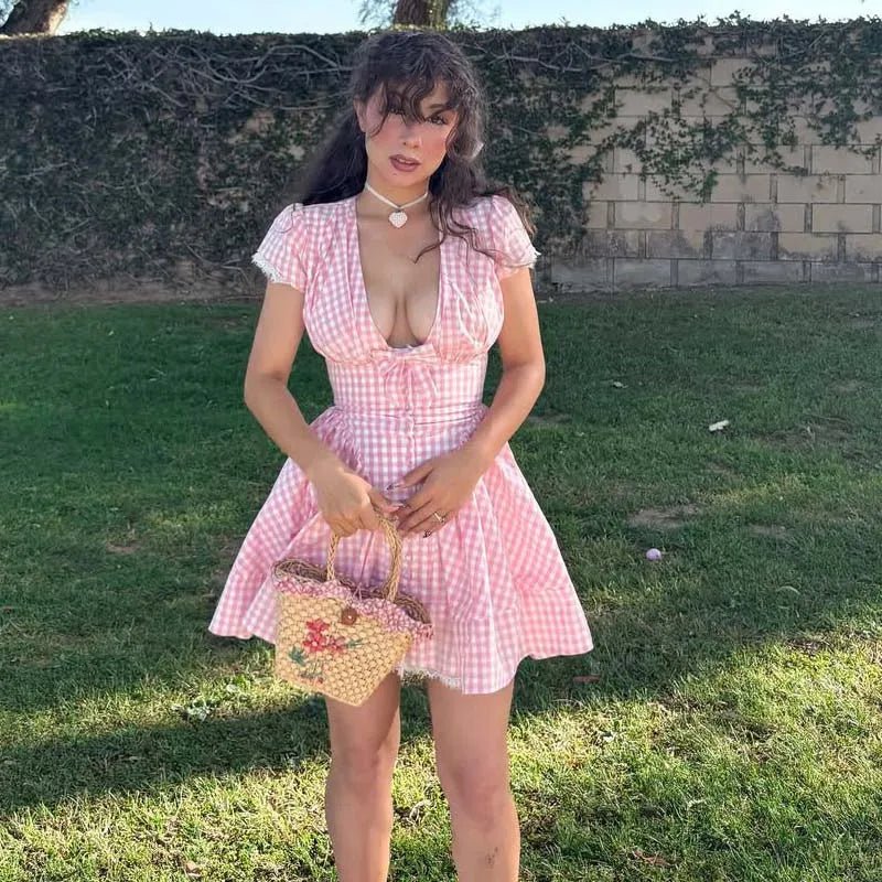 Mini abito a quadri rosa con fiocco Vesna