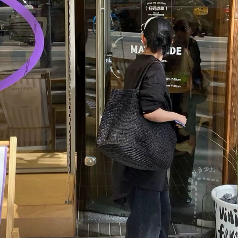 Vivienne borsa a mano in rattan intrecciato