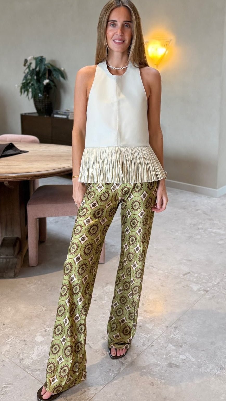 Top allacciato al collo con frange in ecopelle Gina