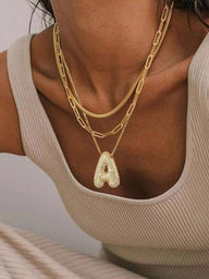 Collana con pendente iniziale a bolle pavé