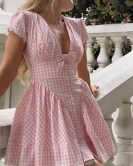 Mini abito a quadri rosa con fiocco Vesna